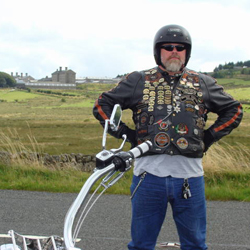 Grizzly with HM Prison, Dartmoor in the background